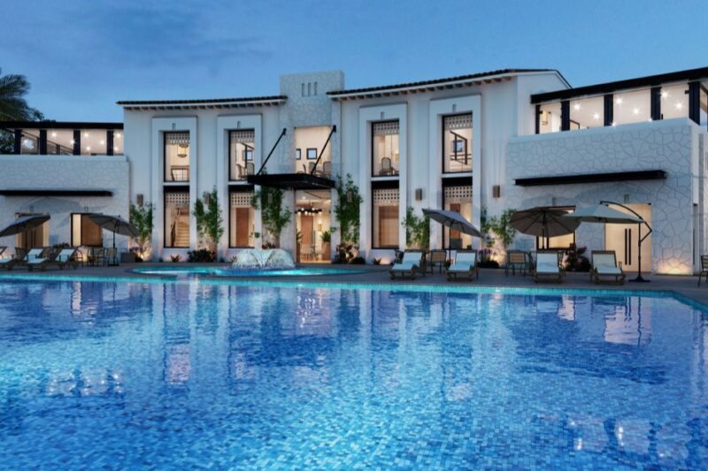 Spacious 4 BHK luxury villa for rent in Chennai featuring a large swimming pool, modern exterior, and premium residential setting.