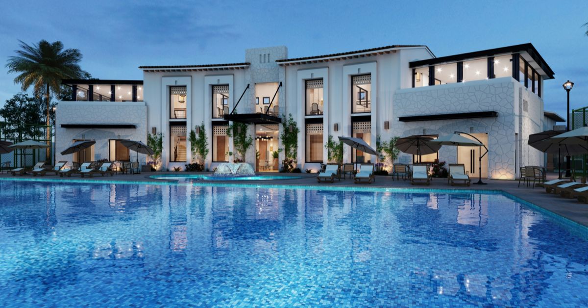 Spacious 4 BHK luxury villa for rent in Chennai featuring a large swimming pool, modern exterior, and premium residential setting.