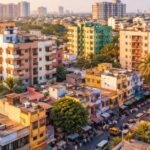 Aerial view of Choolaimedu in Chennai featuring colorful apartment buildings, independent houses, busy streets, and urban residential landscape.