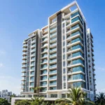 Modern high-rise apartment building showing flats for sale in Chennai, with spacious balconies, glass windows and city views