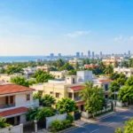 TNHB house for sale in Chennai showing a peaceful residential neighborhood with homes, greenery, roads and skyline.