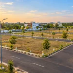 TNHB plots for sale in Chennai showing a modern residential layout with paved roads, marked plots, streetlights and homes